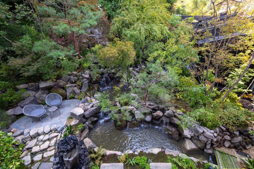 an overhead view of a waterfall in a garden at Bessho Onsen Midoriya in Ueda