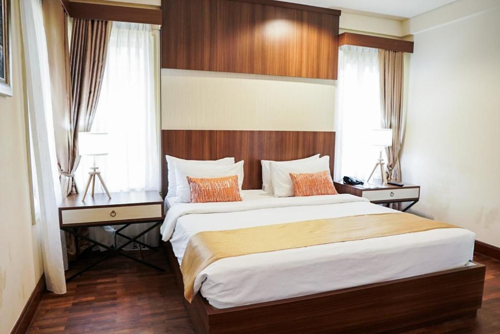 A bed or beds in a room at R Hotel Rancamaya