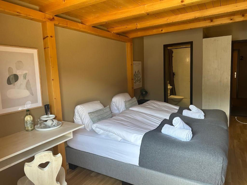 Postel nebo postele na pokoji v ubytování Pez Regina - Nordic Style Alps Hotel