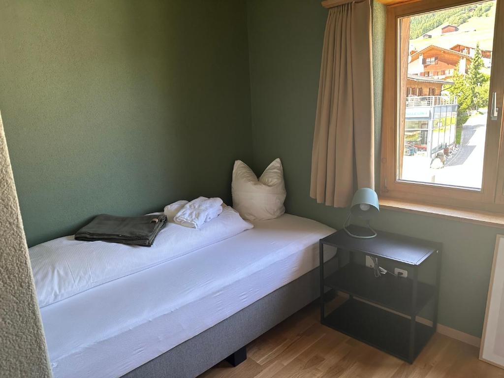 Postel nebo postele na pokoji v ubytování Pez Regina - Nordic Style Alps Hotel