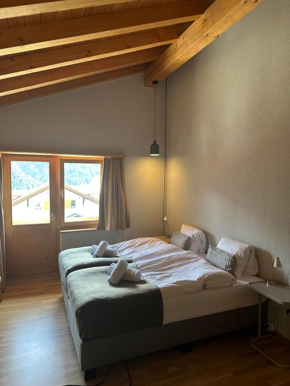 Postel nebo postele na pokoji v ubytování Pez Regina - Nordic Style Alps Hotel