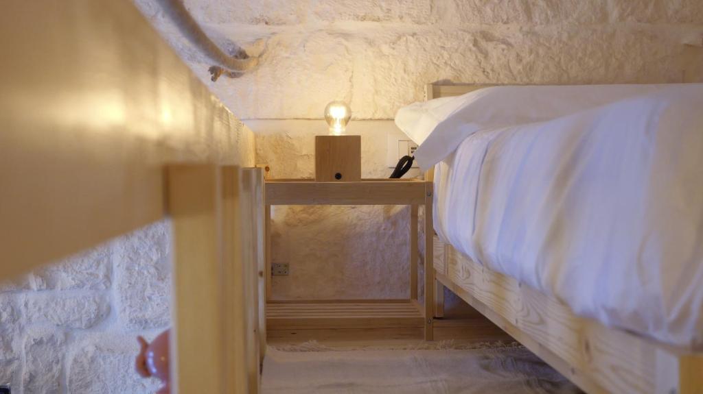 Postel nebo postele na pokoji v ubytování DIMORA ADUA