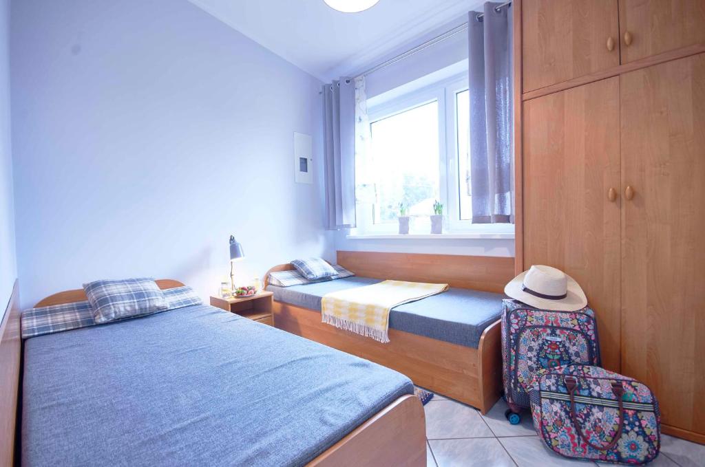 Posteľ alebo postele v izbe v ubytovaní Arenda Apartamenty&Domki całoroczne