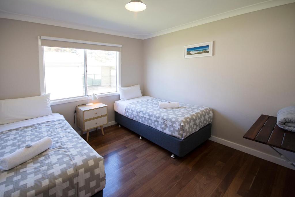 Ein Bett oder Betten in einem Zimmer der Unterkunft Clearwater Motel Apartments