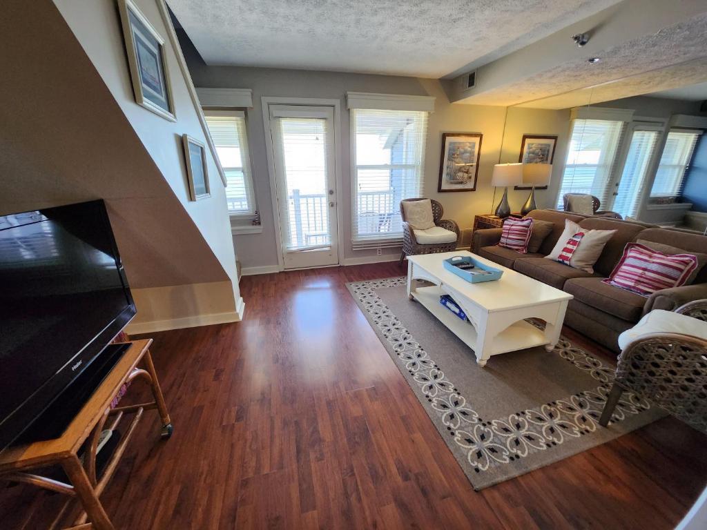 a living room with a couch and a table at North Shore Inn TC 304 in Traverse City