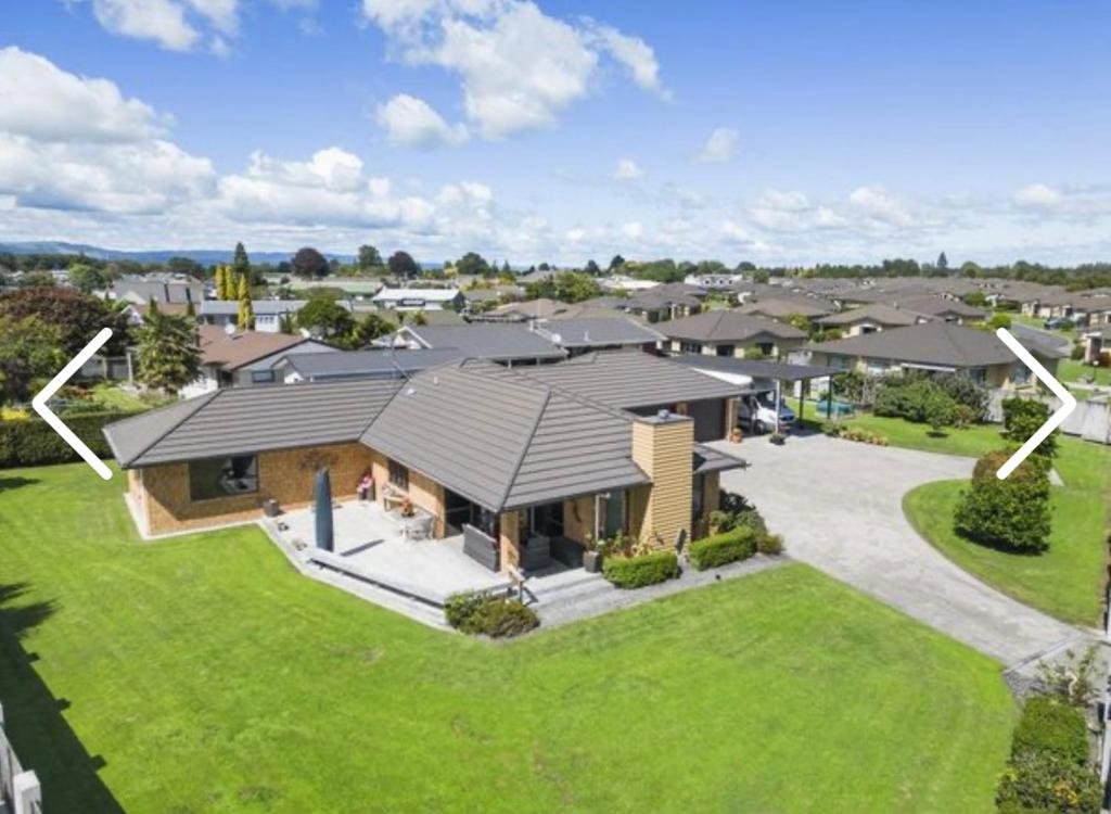 an aerial view of a house with a yard at MataMata in Matamata