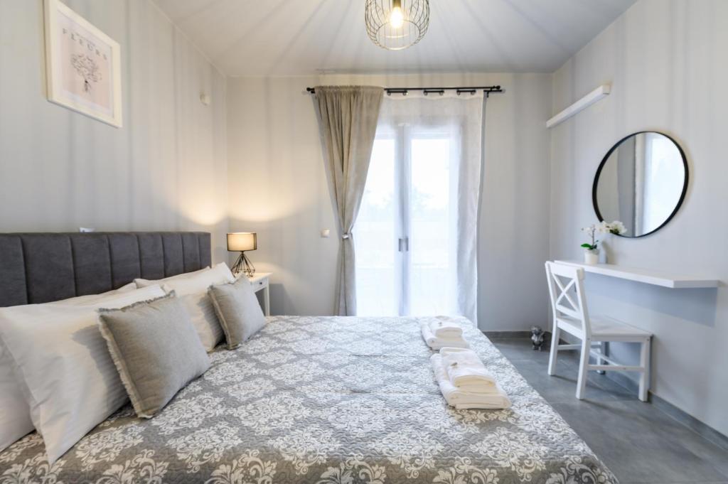 Postel nebo postele na pokoji v ubytování Dalie Luxury Suites