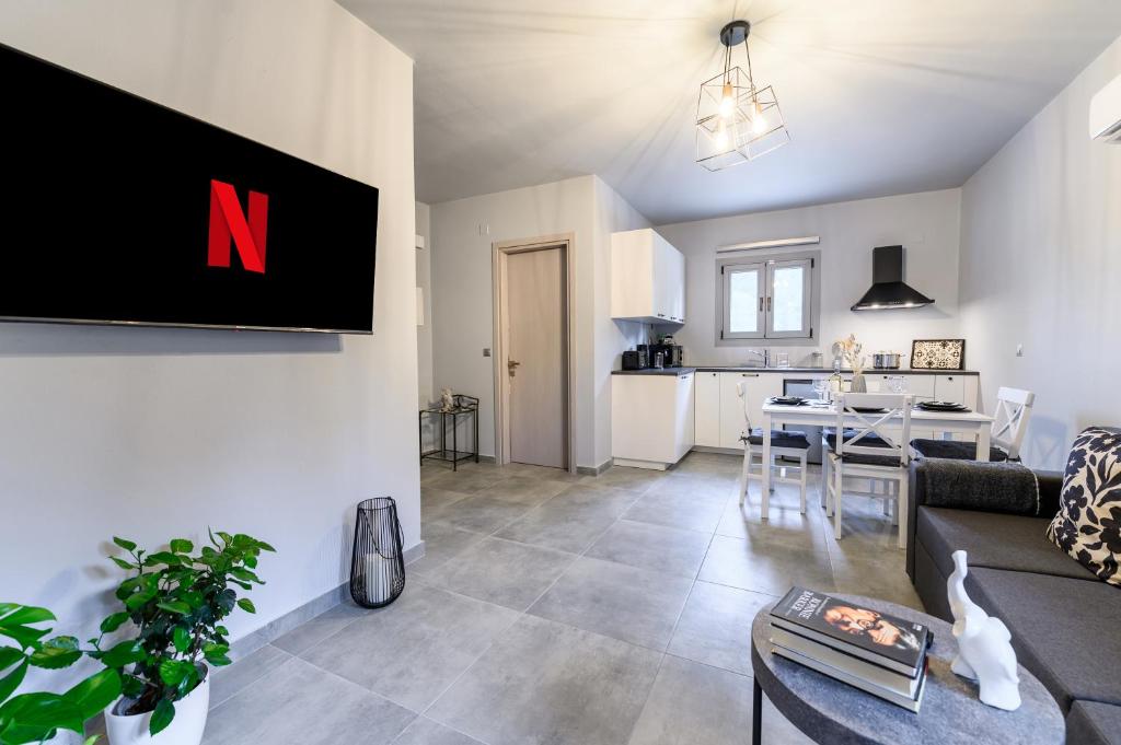 TV a/nebo společenská místnost v ubytování Dalie Luxury Suites