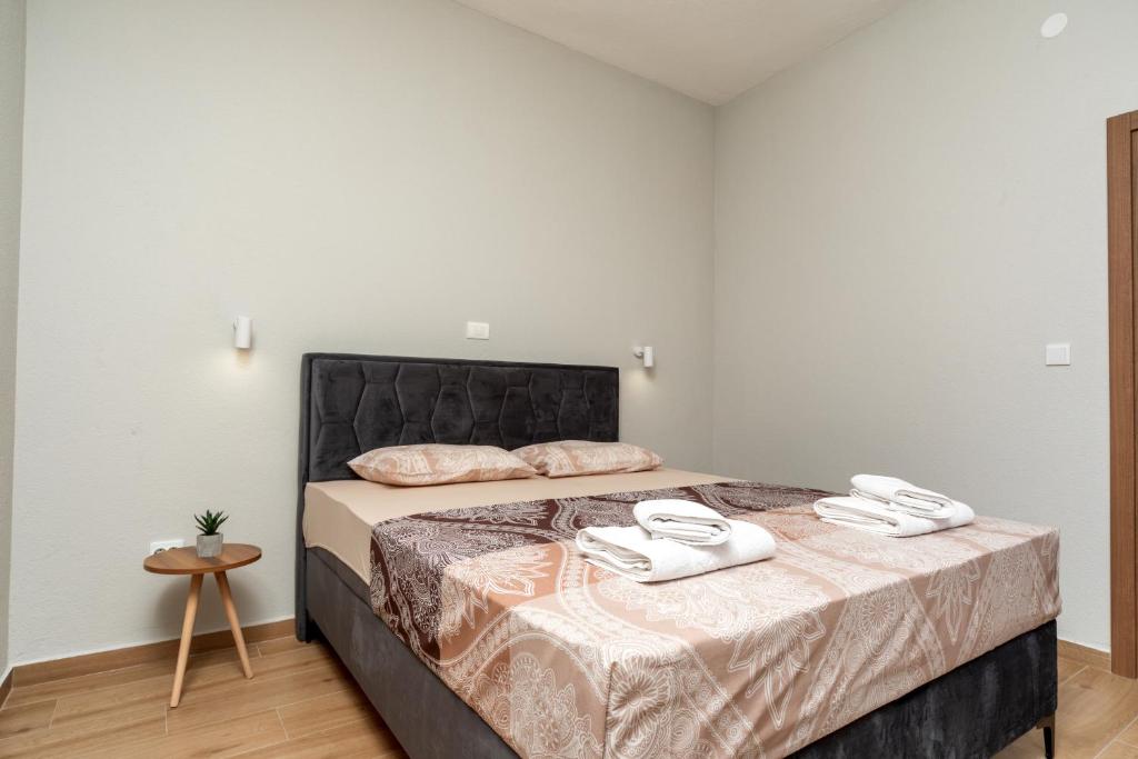 Vuode tai vuoteita majoituspaikassa Apart Hotel XXL Lux