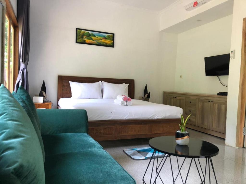 Un pat sau paturi într-o cameră la Bale Kebon Rangsot