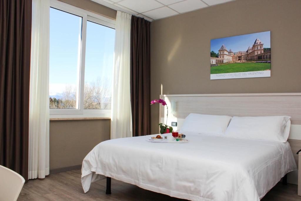 Postel nebo postele na pokoji v ubytování Best Quality Hotel La Darsena