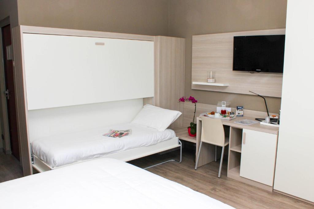 Postel nebo postele na pokoji v ubytování Best Quality Hotel La Darsena