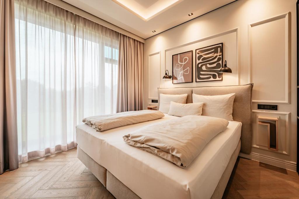 Postel nebo postele na pokoji v ubytování Fasson Hotel