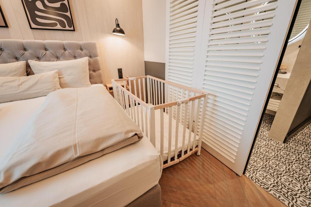 Postel nebo postele na pokoji v ubytování Fasson Hotel