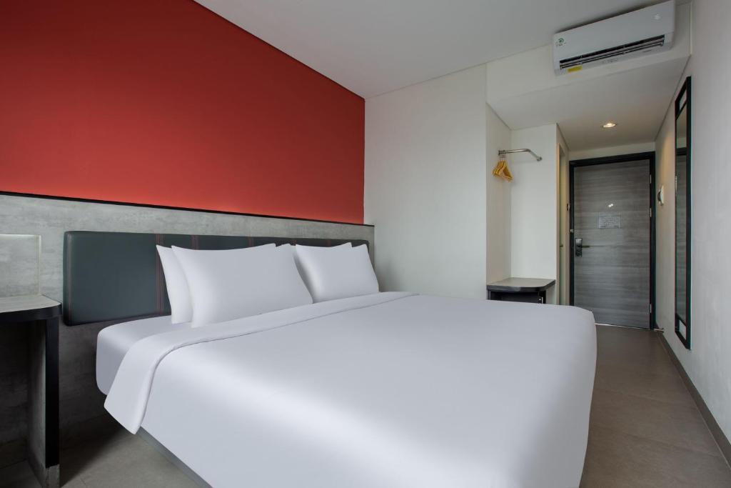 Postel nebo postele na pokoji v ubytování Amaris Hotel Kalimalang