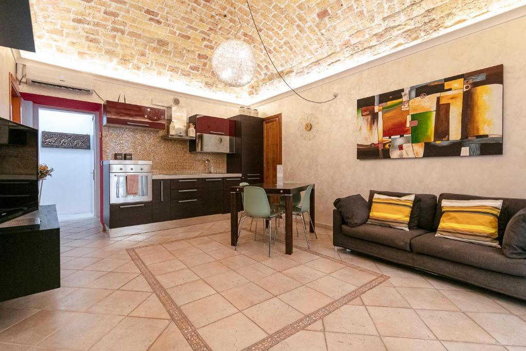 a living room with a couch and a table at IamartinoApartments in Termoli