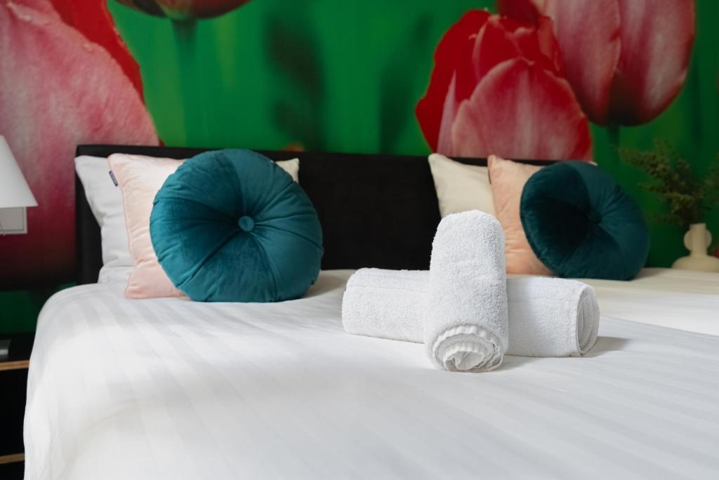 Postel nebo postele na pokoji v ubytování Multatuli Hotel