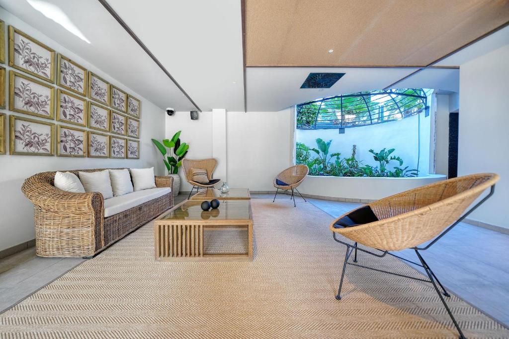 a living room with a couch and a table at HOVIMA Suites Costa Adeje in Adeje