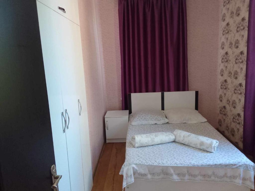 Postel nebo postele na pokoji v ubytování natia