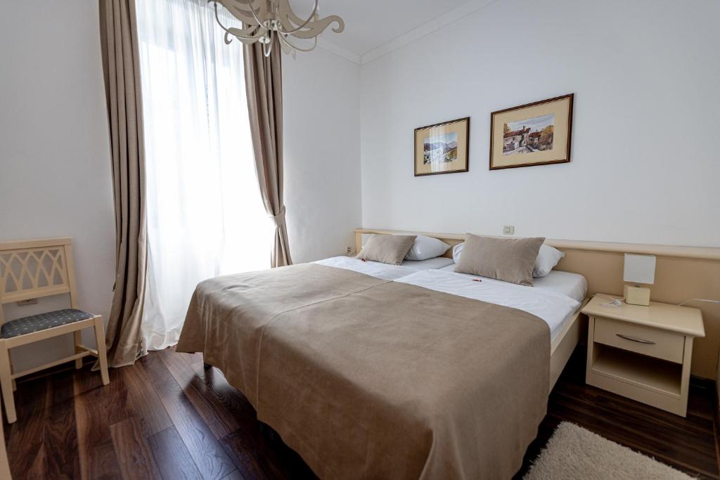 Łóżko lub łóżka w pokoju w obiekcie Boutique Hotel Kaštel