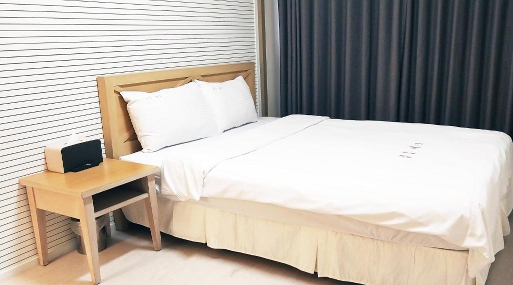Postel nebo postele na pokoji v ubytování Golden Park Hotel