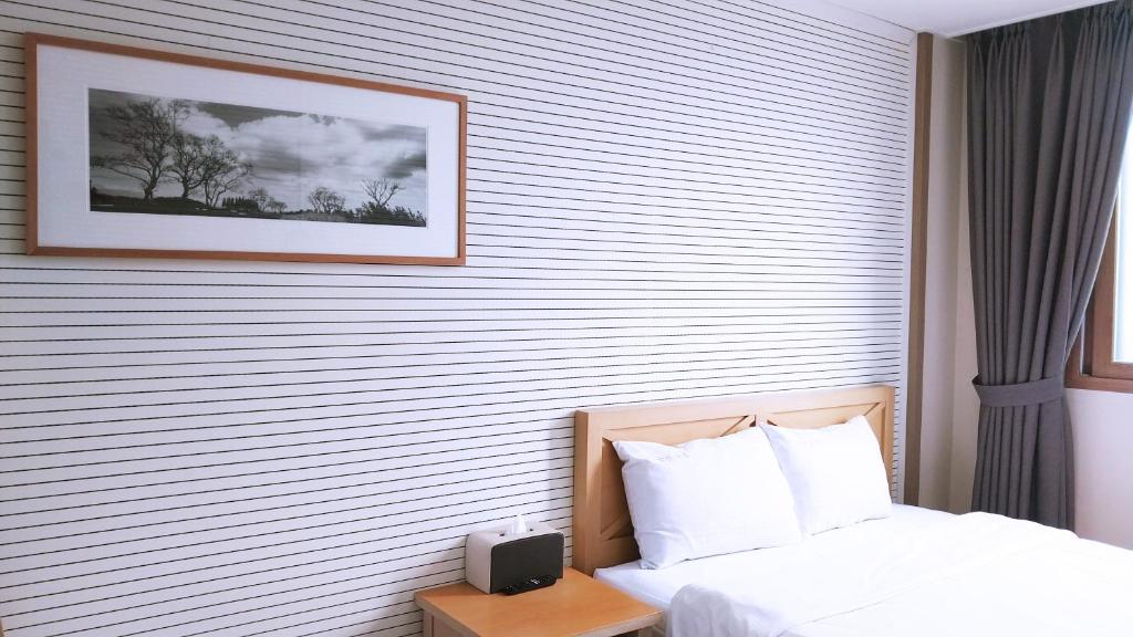 Postel nebo postele na pokoji v ubytování Golden Park Hotel