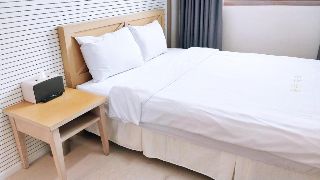 Postel nebo postele na pokoji v ubytování Golden Park Hotel