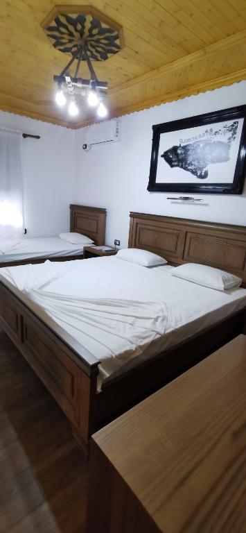 Postel nebo postele na pokoji v ubytování Hazmurat Hotel