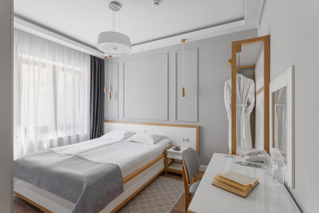 Postel nebo postele na pokoji v ubytování Frapolli 21 Hotel