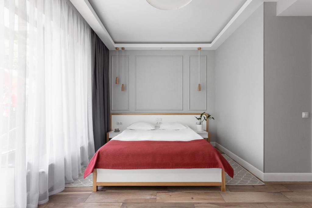 Postel nebo postele na pokoji v ubytování Frapolli 21 Hotel