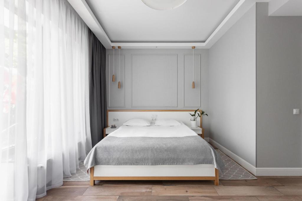 Postel nebo postele na pokoji v ubytování Frapolli 21 Hotel