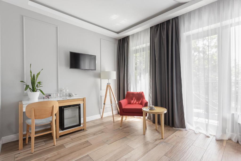 TV a/nebo společenská místnost v ubytování Frapolli 21 Hotel