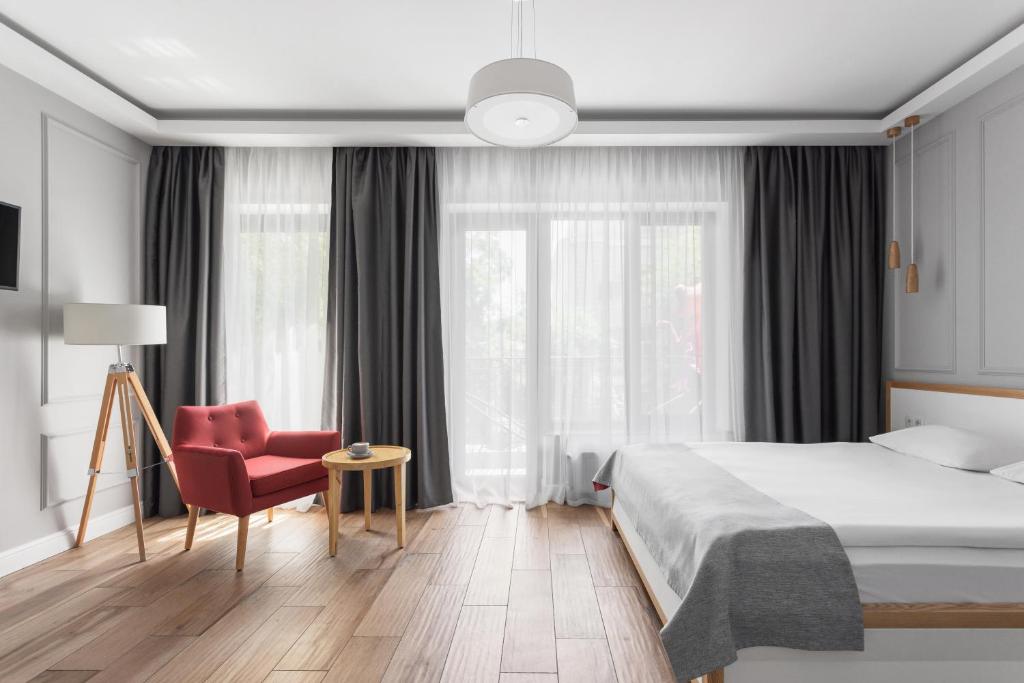 Postel nebo postele na pokoji v ubytování Frapolli 21 Hotel