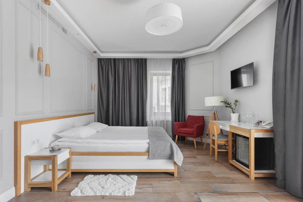 Postel nebo postele na pokoji v ubytování Frapolli 21 Hotel