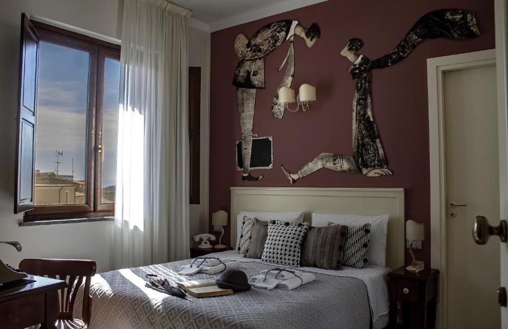 Postel nebo postele na pokoji v ubytování Albergo Merùo