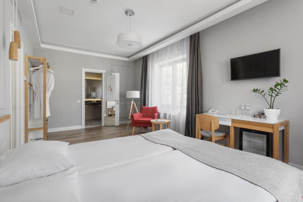 TV a/nebo společenská místnost v ubytování Frapolli 21 Hotel