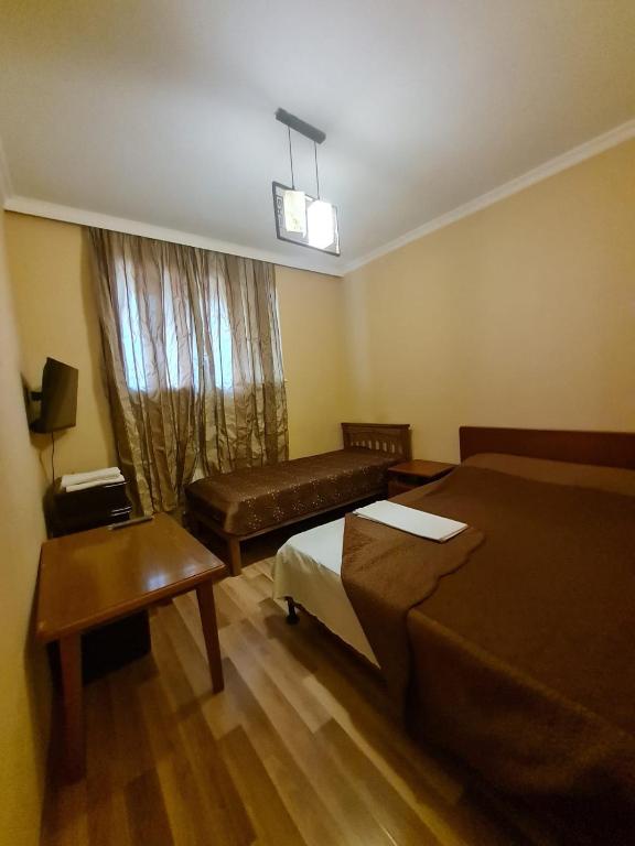 Postel nebo postele na pokoji v ubytování Piano Hotel