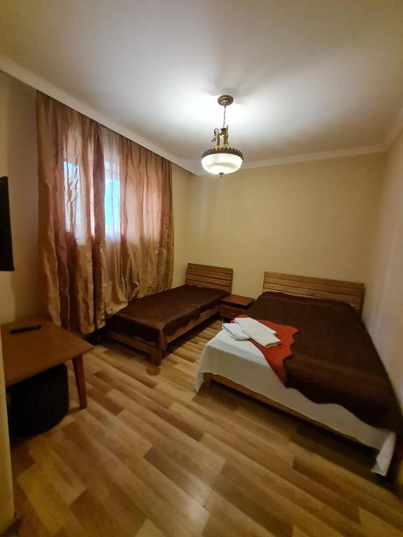 Postel nebo postele na pokoji v ubytování Piano Hotel