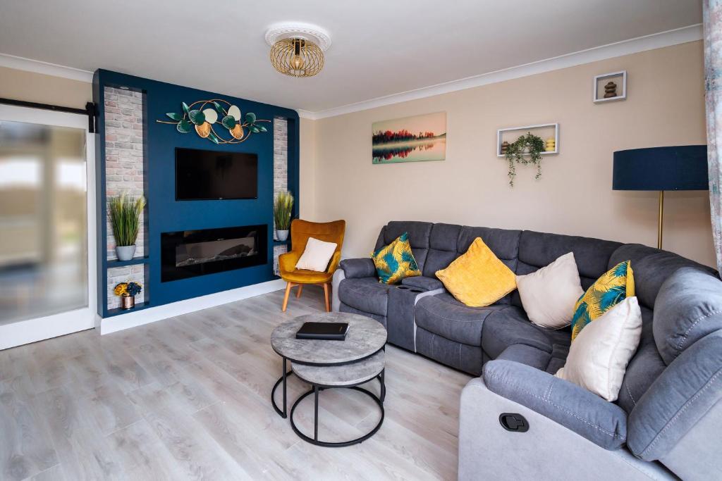 a living room with a couch and a chair at 9 Parklands Holiday home in Killarney