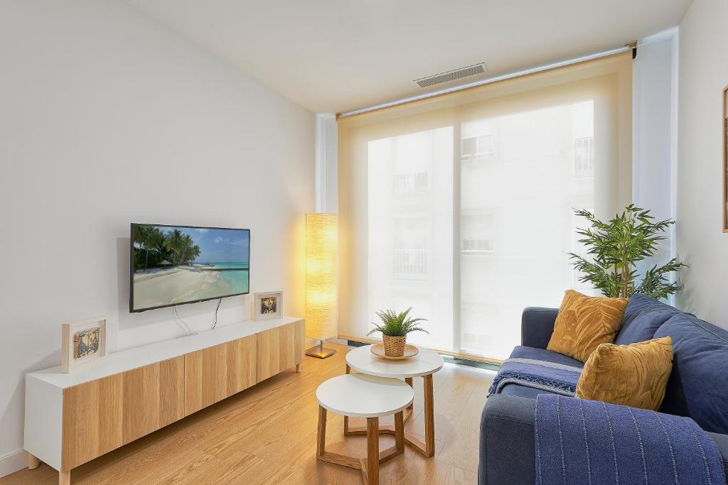 Televízia a/alebo spoločenská miestnosť v ubytovaní Holidays Elite