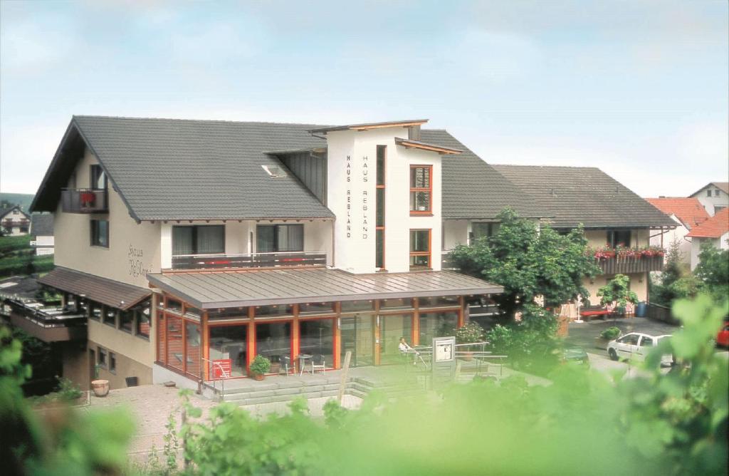 a large house with a lot of windows at Hotel Restaurant Haus Rebland in Baden-Baden