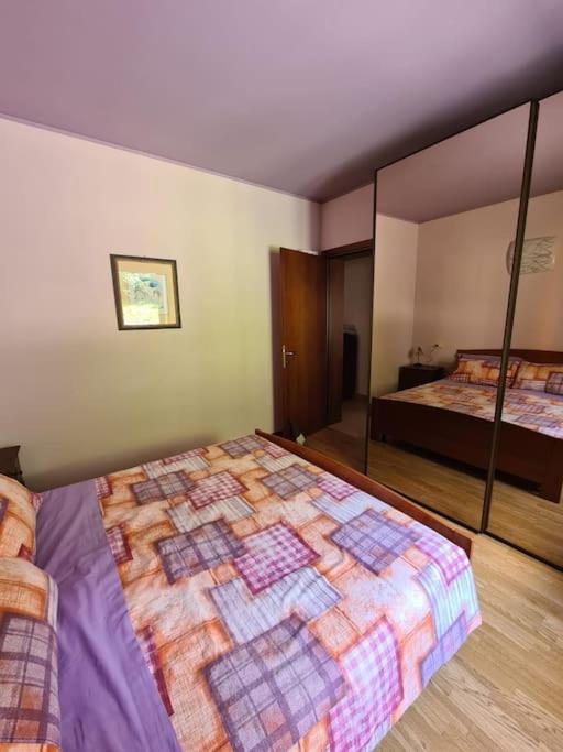 Postel nebo postele na pokoji v ubytování Incantevole appartamento in riva al Piave
