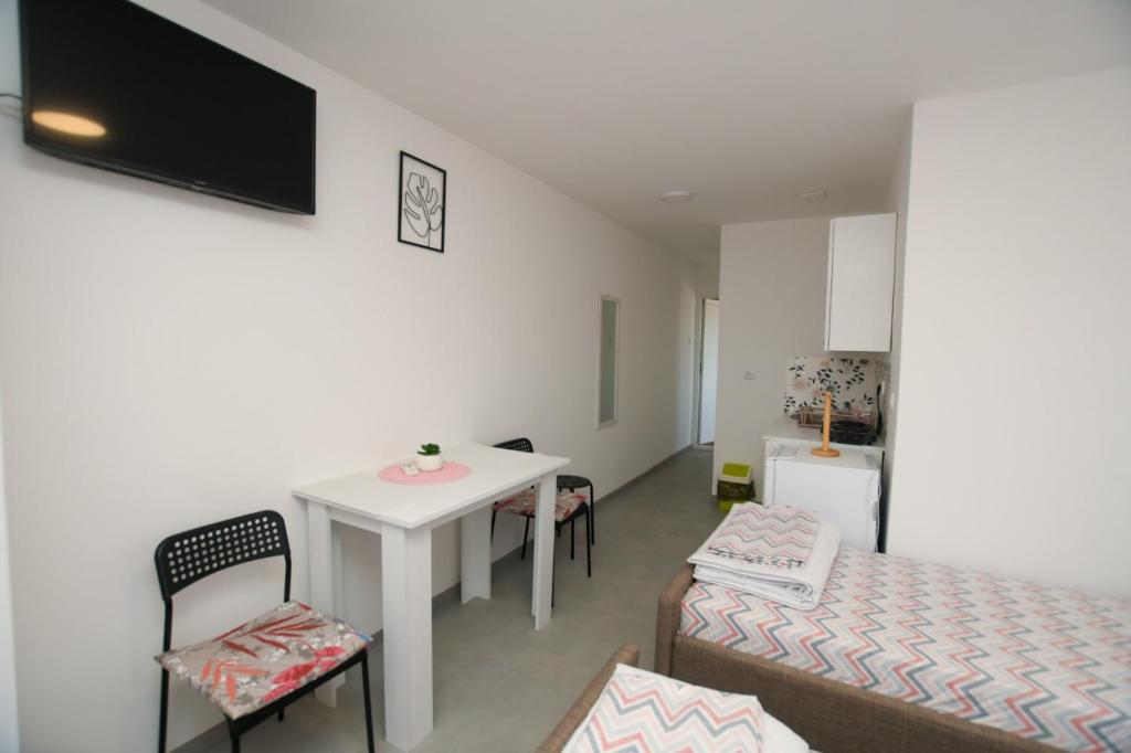 TV a/nebo společenská místnost v ubytování Olymp Apartmani