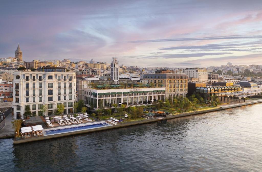 a view of a city with a river and buildings at The Peninsula Istanbul in Istanbul