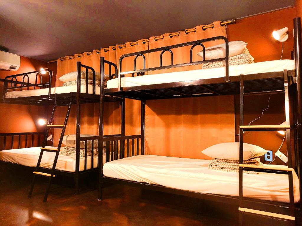 two bunk beds are in a room at Good Guesthouse in Seoul