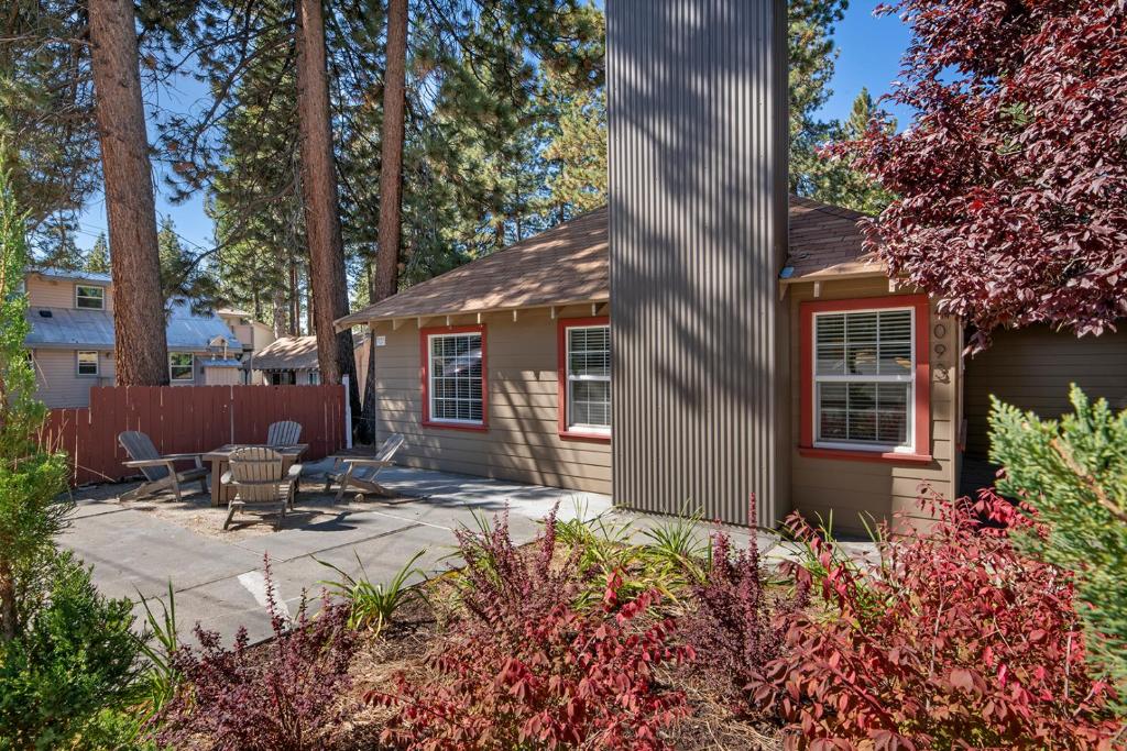a small house with a patio and a fence at Manzanita Holiday in South Lake Tahoe