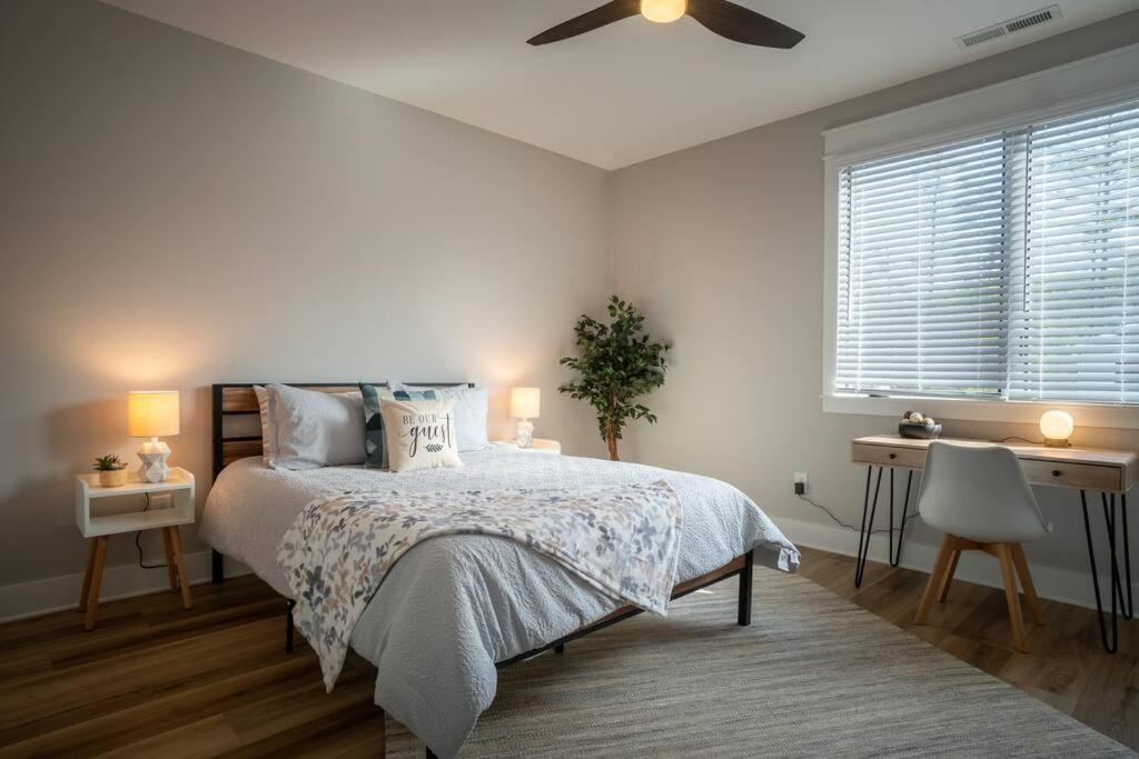 a bedroom with a bed and a ceiling fan at Walk to Helen Downtown-Gated Golf Resort in Helen