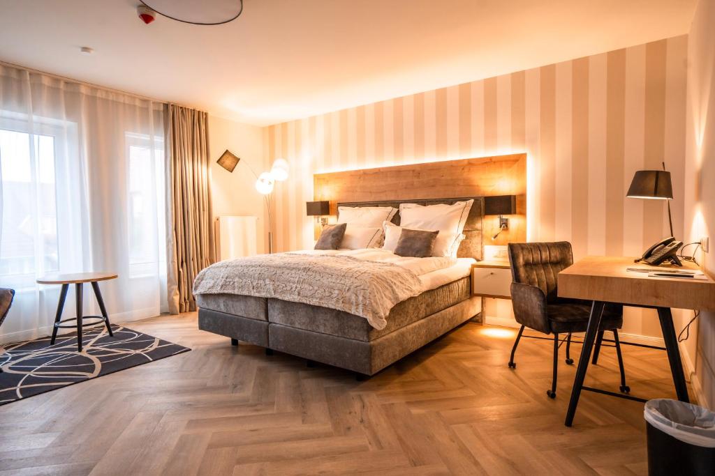 Postel nebo postele na pokoji v ubytování Hotel MeerZeiten inklusive externer Schwimmbad- & Saunanutzung