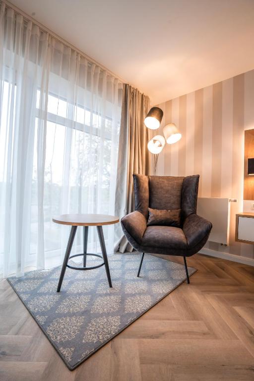 Posezení v ubytování Hotel MeerZeiten inklusive externer Schwimmbad- & Saunanutzung