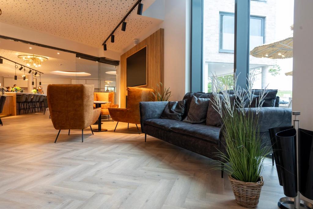 Posezení v ubytování Hotel MeerZeiten inklusive externer Schwimmbad- & Saunanutzung